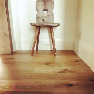 Wooden chair on reclaimed white oak floor