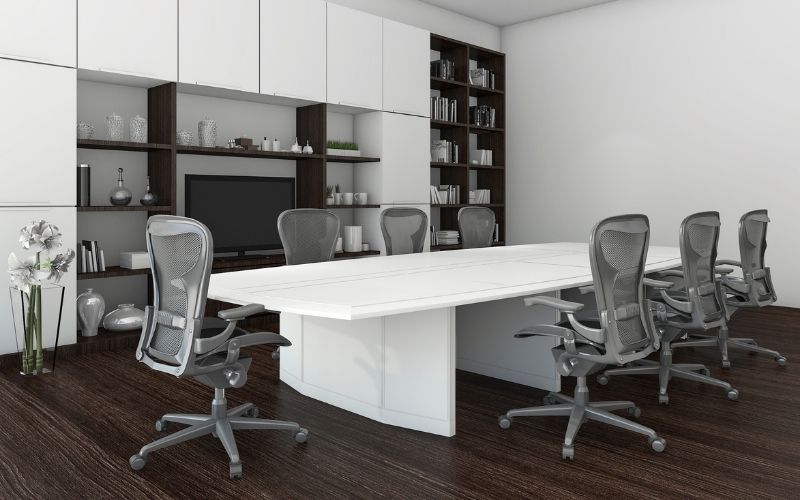 Dark wood floor office with metal chairs