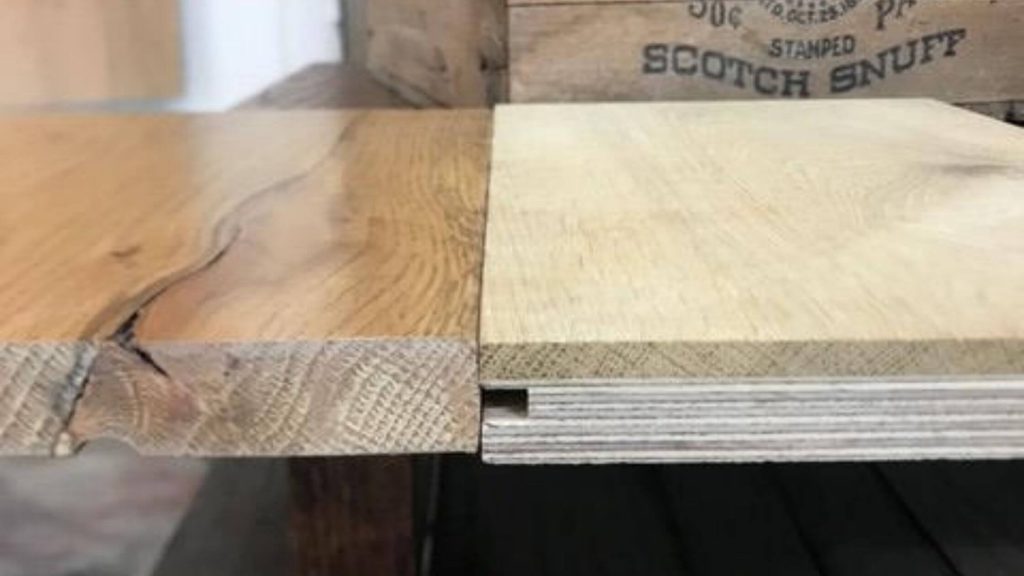 Solid wood board next to engineered wood board